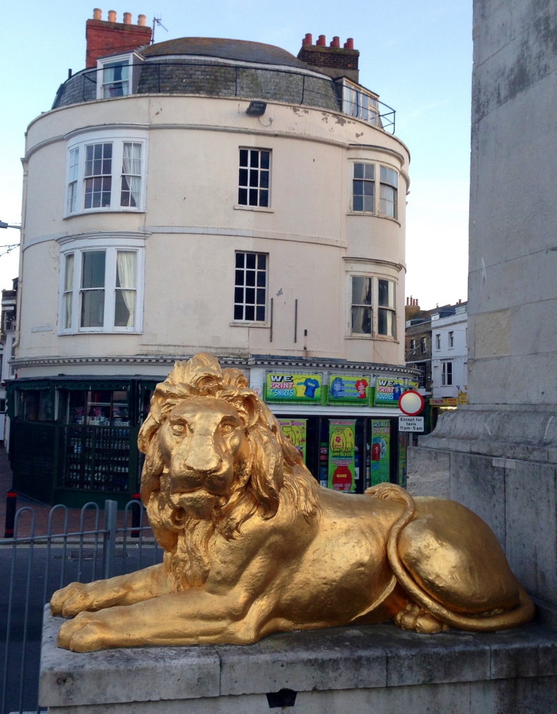 Loopy lion languishing luxuriously under a few pounds of gold leaf at King George's feet
